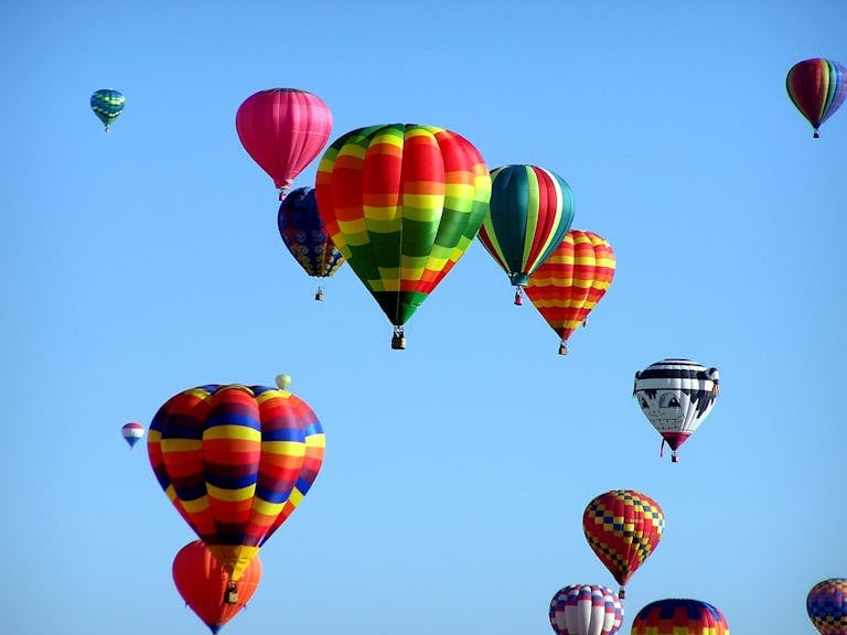 Red Green Hot Air Balloon during Daytime